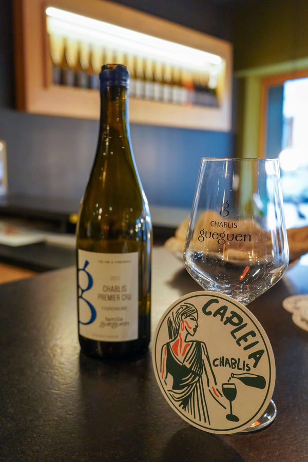 Set of 6 coasters featuring elegant design of a woman enjoying Chablis wine, made from organic cotton.